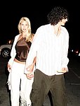 Shockjock Howard Stern and girlfriend Beth Ostrosky making a dash for their car at the Hamptons hotspot the Star Room on 6-12-04<br>photo by Rob Rich copyright 2004<br>516-676-3939<br>robwayne1@aol.com